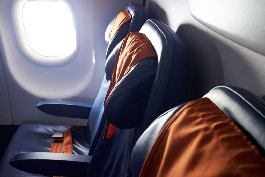 Choose a good seat to sleep on airplane